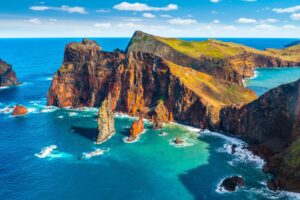 Red volcanic cliffs and turquoise Atlantic water at Ponta de São Lourenço, Madeira